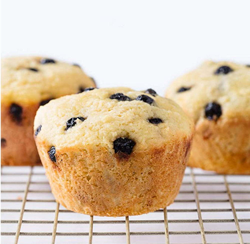 Closeup view of three MissJonesBaking Keto Paleo Blueberry Muffins that are gluten free